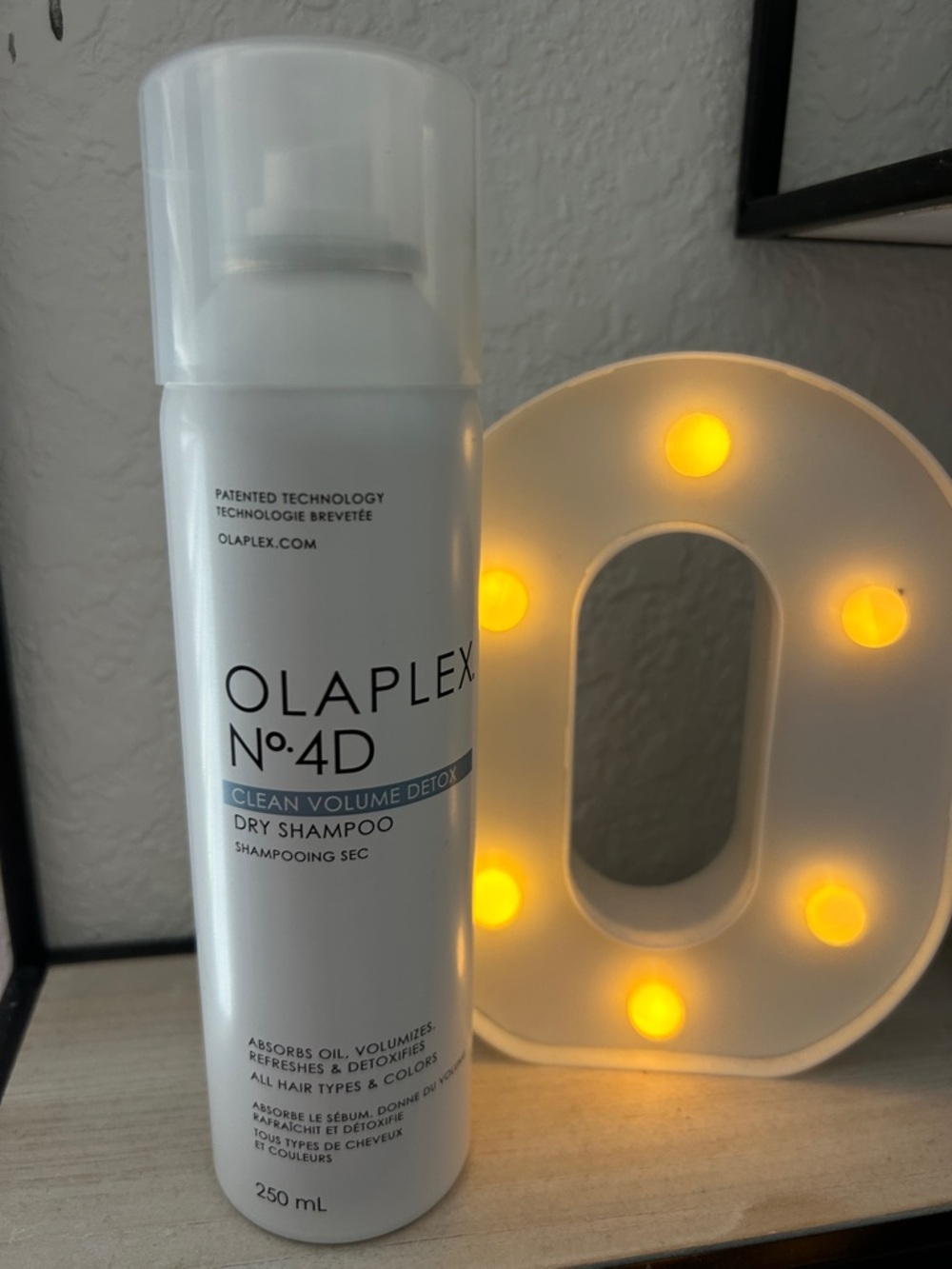 OLAPLEX No. 4D Dry Shampoo — White Bottle with Yellow Light Accent